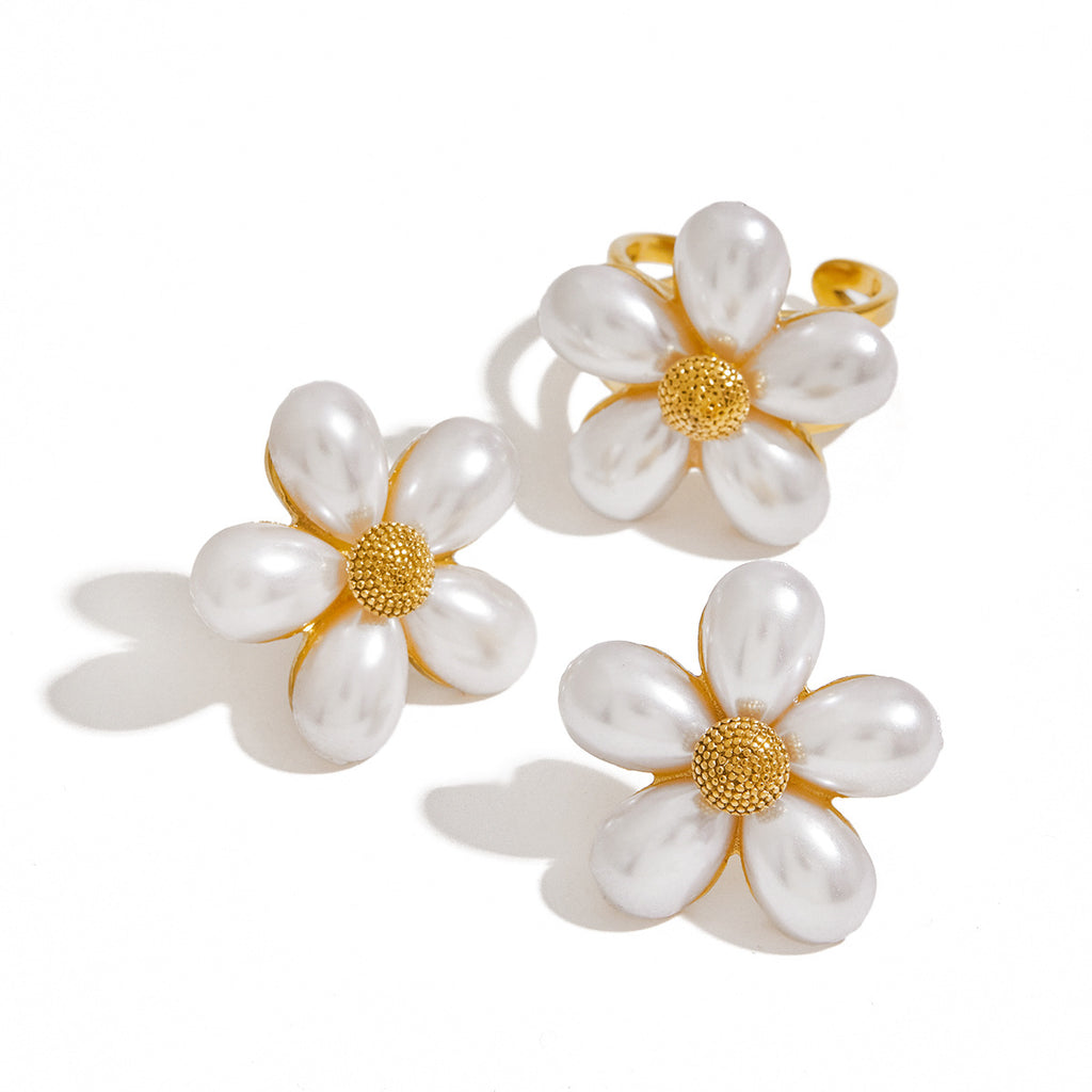 White petal flower ring shown with the separately selectable stud earrings