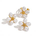White petal flower ring shown with the separately selectable stud earrings