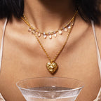 Gold-tone embossed heart jewelry collection styled on model
