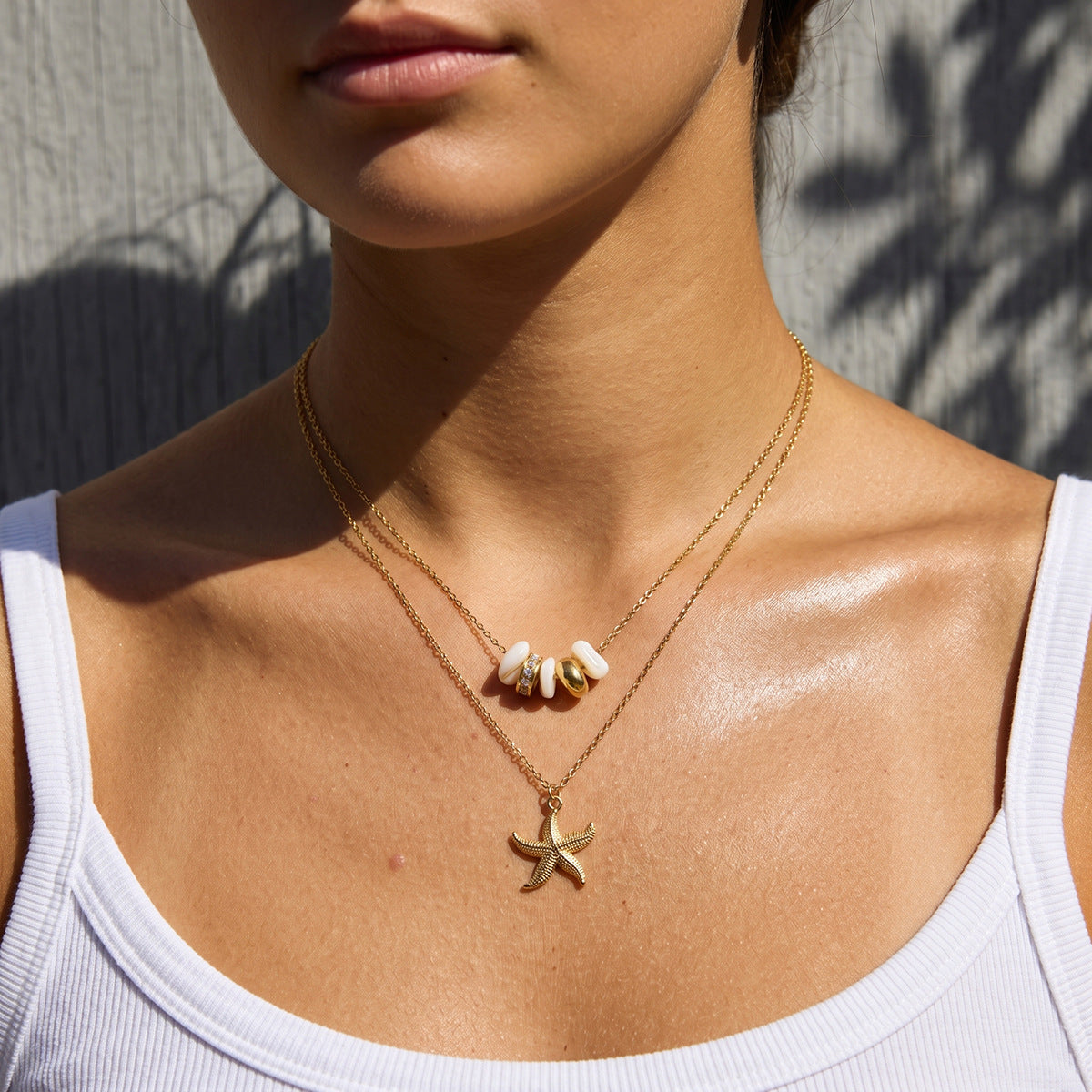 Starfish necklace with white and gold tone bead layer