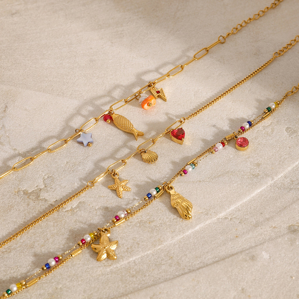 Gold Plated Stainless Steel Ocean Charm Bracelet Collection — front view