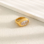 angled oval clear-stone statement ring on a pale surface