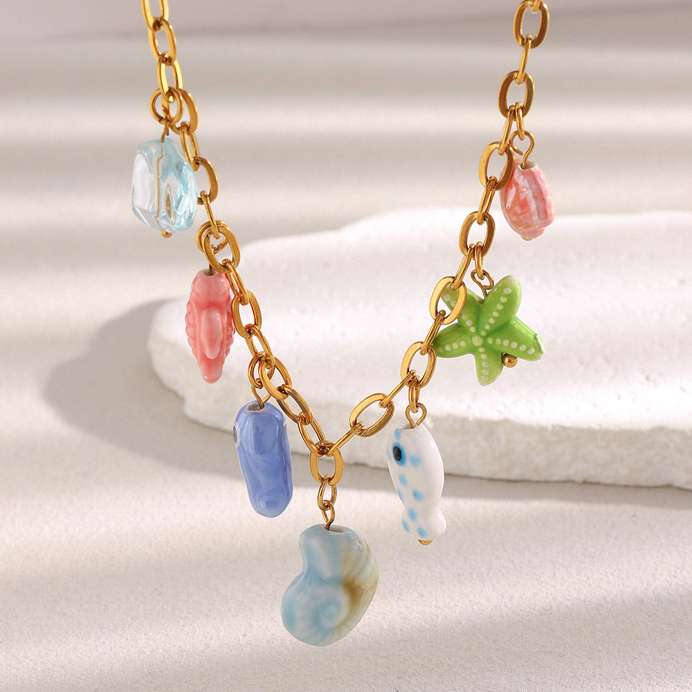 close view of colorful fish starfish shell and seahorse charms