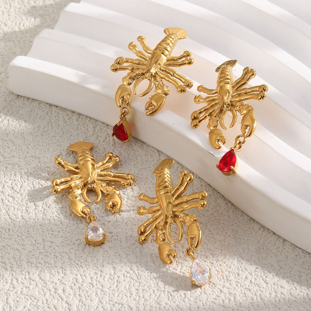 Red and clear drop lobster earring pairs displayed together