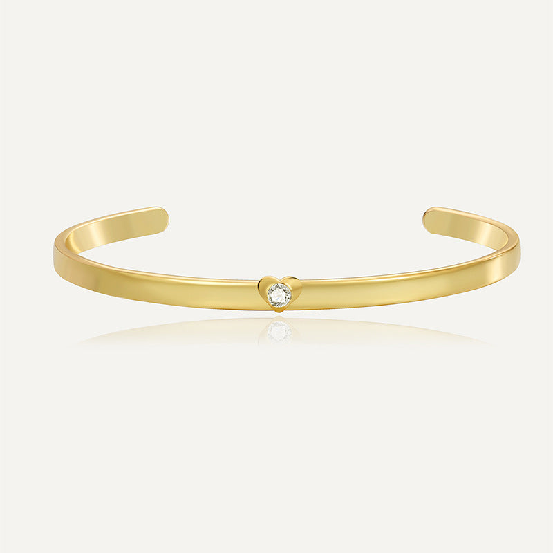 gold plated heart clear stone open cuff bracelet on white