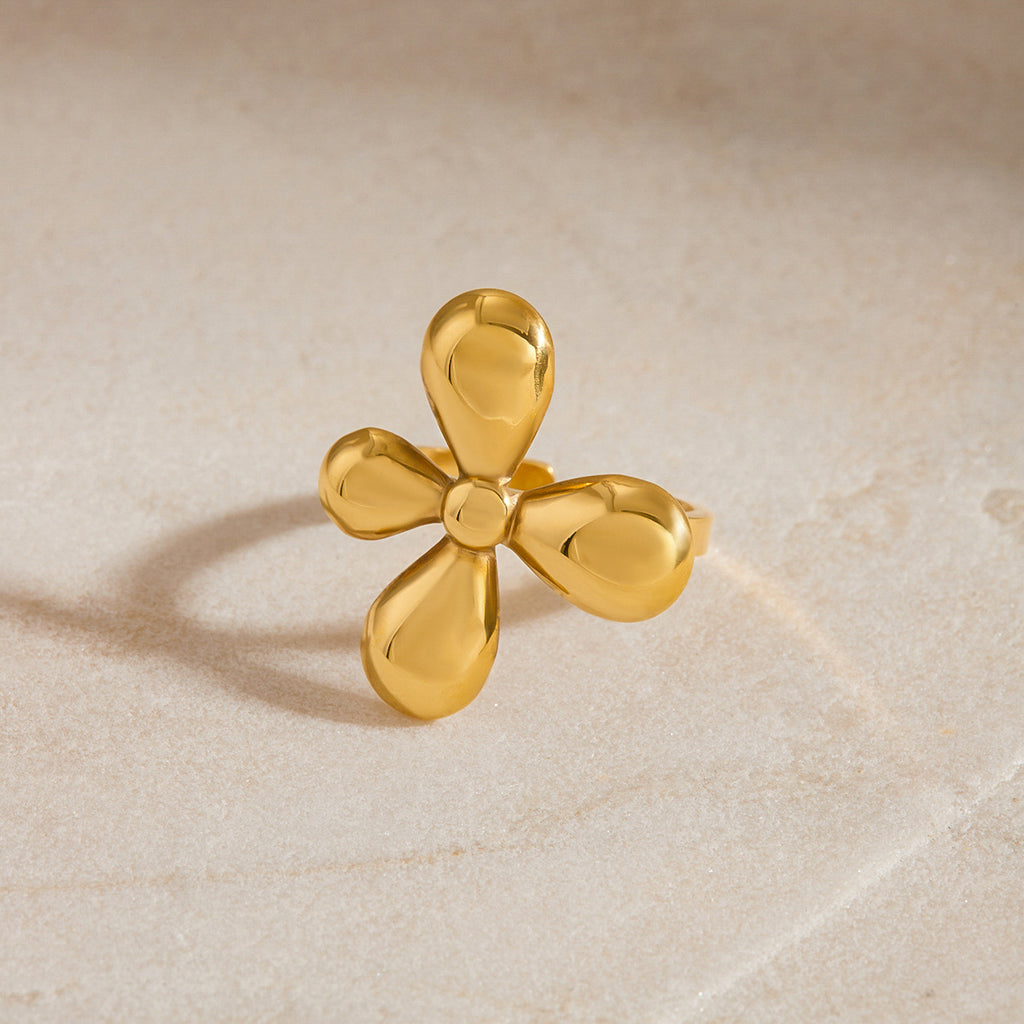 Angled view of rounded petals and slim ring band