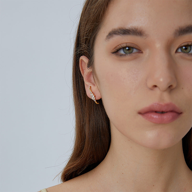 model wearing curved zirconia ear climber earring