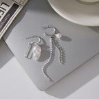 silver-finish mismatched imitation pearl tassel earring pair