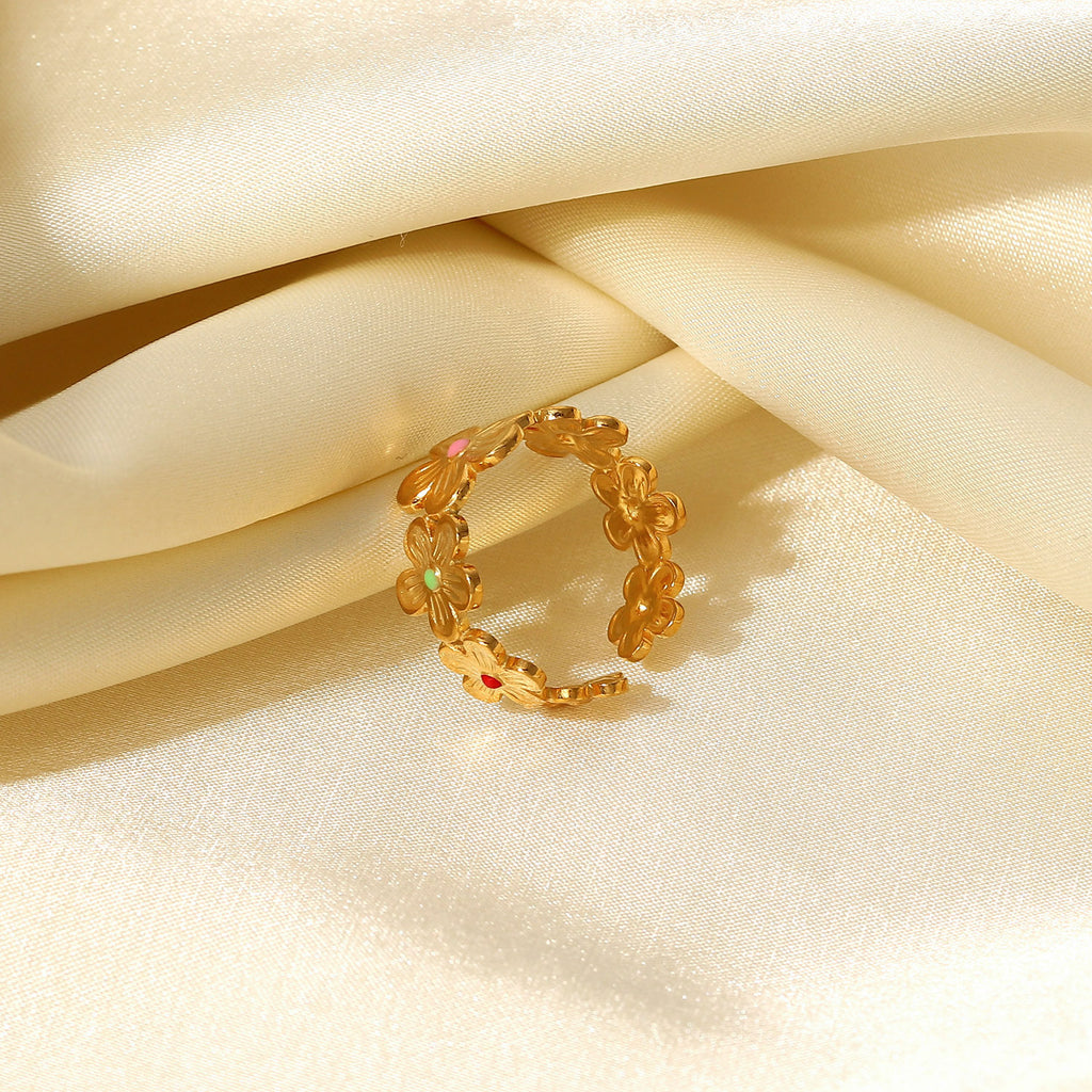 Open flower band resting on satin