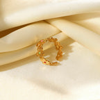 Open flower band resting on satin