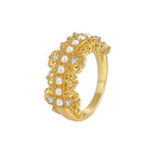 white-background view of vintage-style shell pearl and clear-stone ring