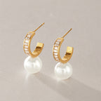 Pair of baguette zirconia hoops with white glass pearl drops