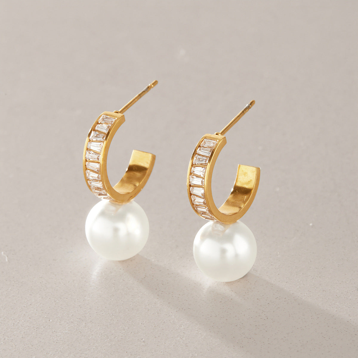 Pair of baguette zirconia hoops with white glass pearl drops