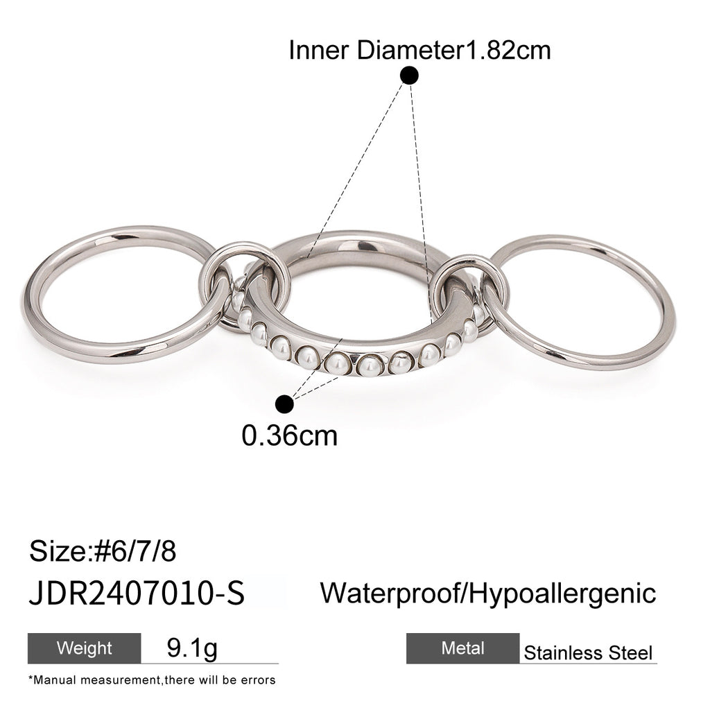 Silver-tone linked rings with white accents and measurements