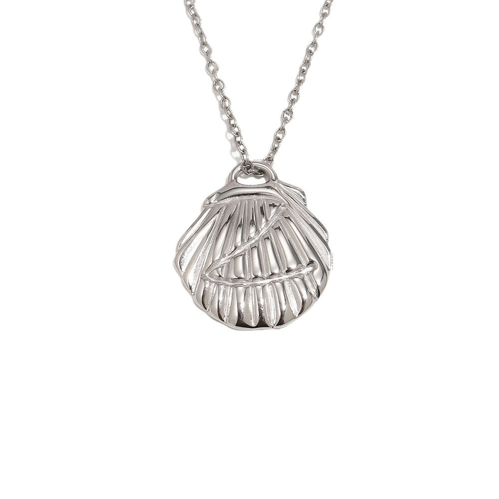 Silver tone scallop shell pendant on a fine chain