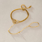 Gold-tone hand bracelet arranged with its finger loop