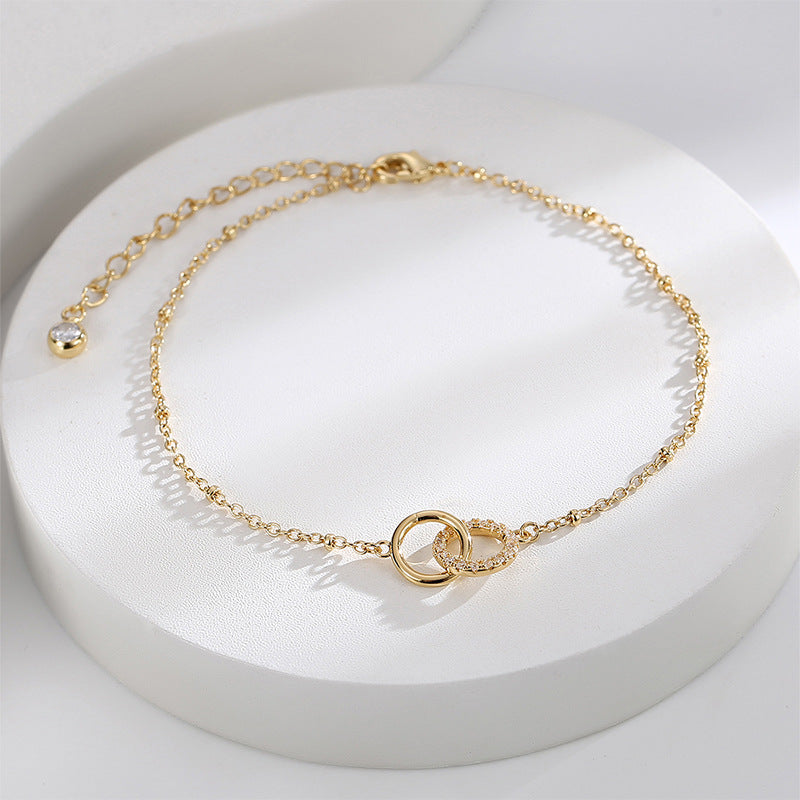 interlocking ring anklet arranged on a white display