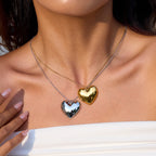 Layered heart necklaces showing two finish colors