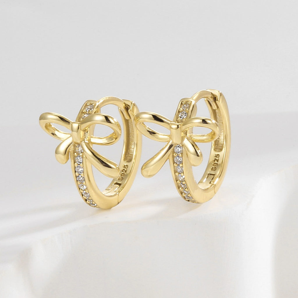 925 Sterling Silver Bow Zirconia Huggie Hoop Earrings — upright gold pair with pave detail