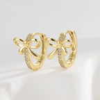 925 Sterling Silver Bow Zirconia Huggie Hoop Earrings — upright gold pair with pave detail