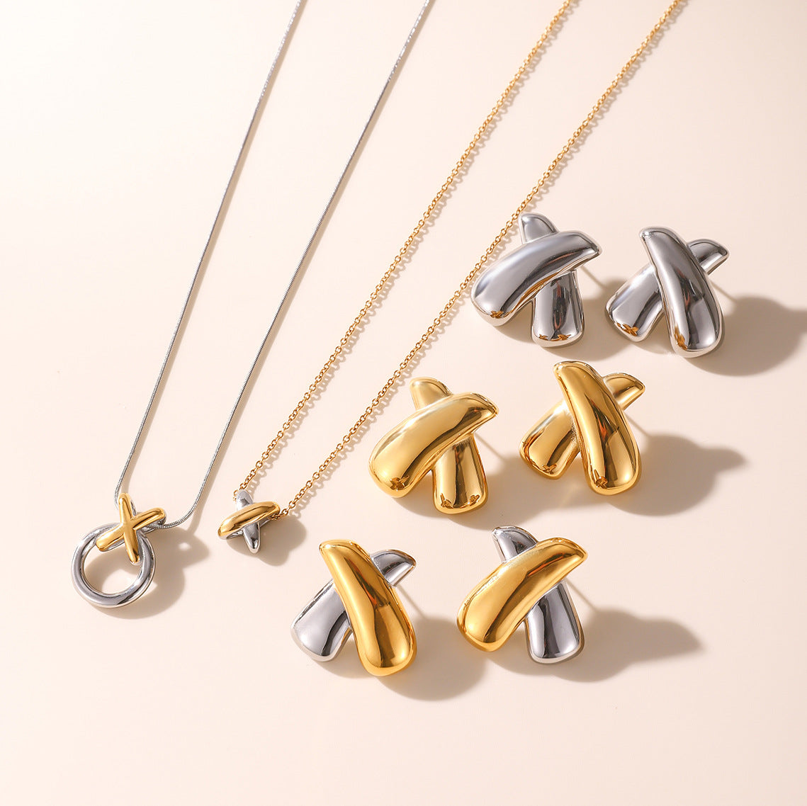 Wholesale Stainless Steel Bow Stud Earrings and Pendant Necklace Collection - side profile