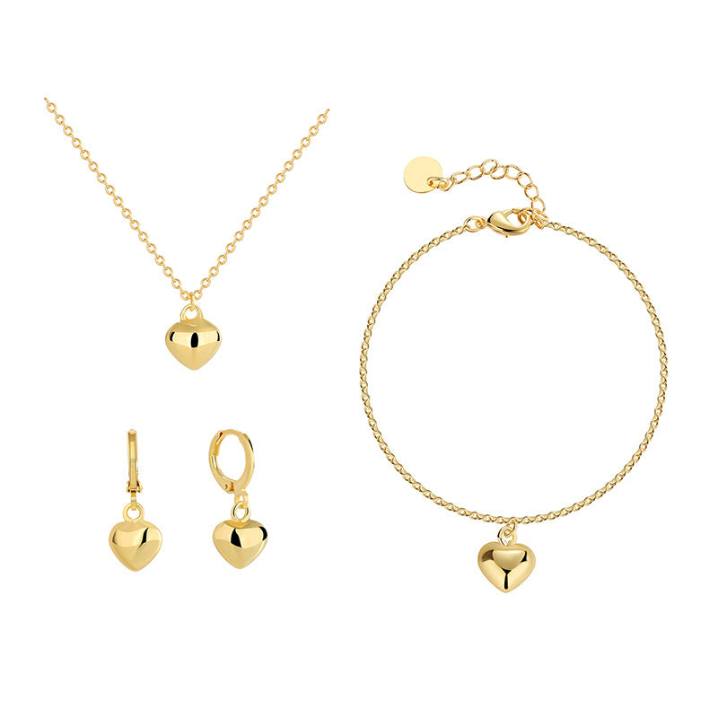 isolated gold plated brass heart three-piece jewelry set