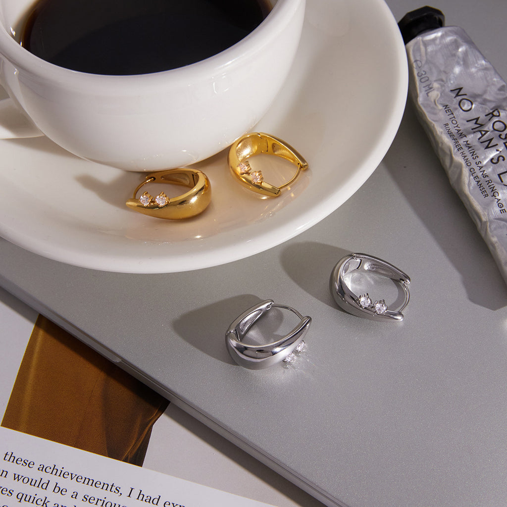 Tapered hoops beside a cup