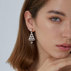 Long clear stone Christmas tree earrings shown worn