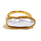 isolated gold plated elongated pearl cocktail ring
