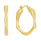brass wavy oval hoop earrings shown from front and side