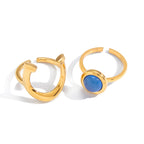 Blue resin horseshoe ring viewed from the front and rear on a white background