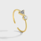 side profile of the bezel-style triangle and round stone settings