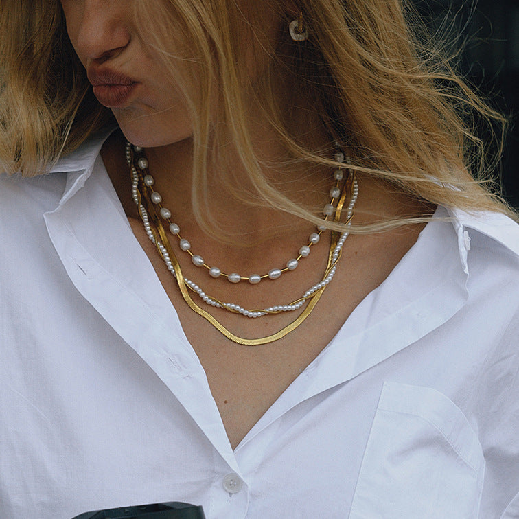 Gold-Tone Layered Stainless Steel Necklace and Huggie Earring Collection shown on model