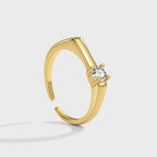 gold plated brass open ring with round clear stone