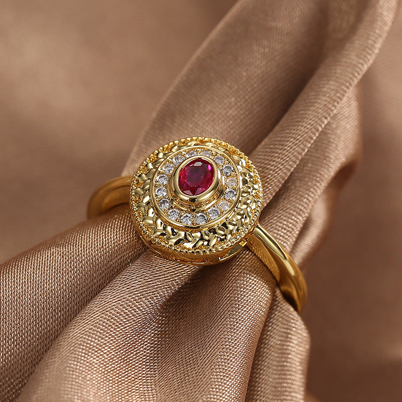 front view of textured gold plated medallion cocktail ring