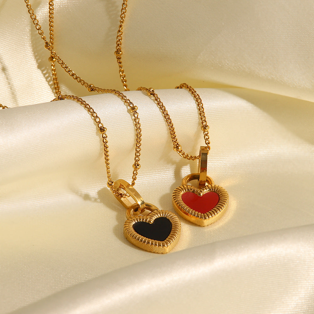 Black and red heart necklaces shown together for color comparison