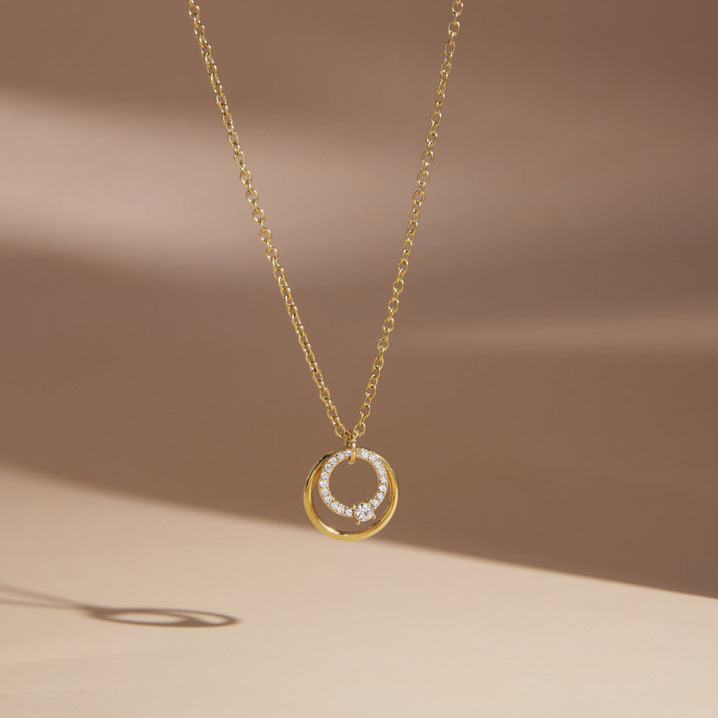 Single circle pendant necklace on pale display