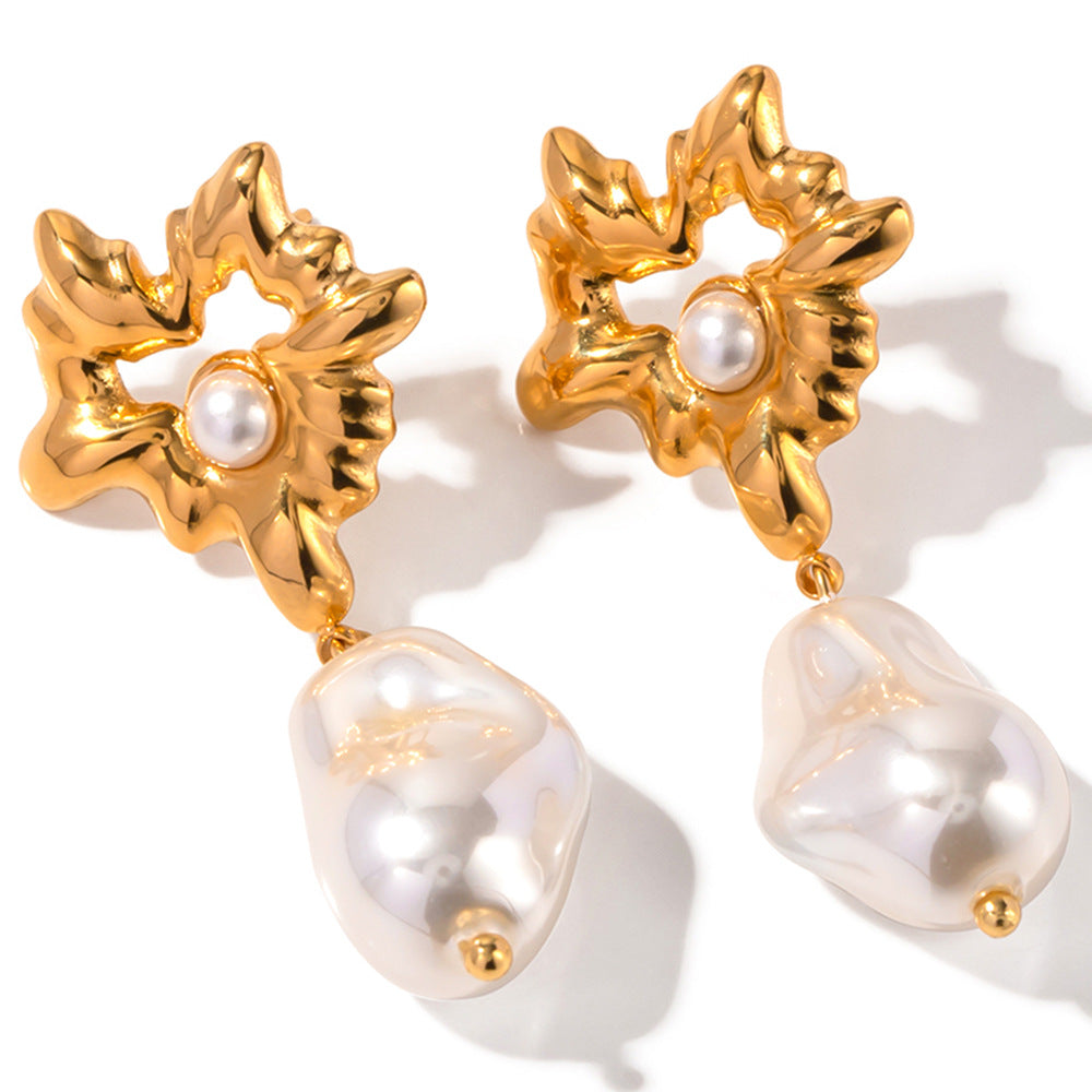 Gold-tone flower earrings with irregular white bead front view