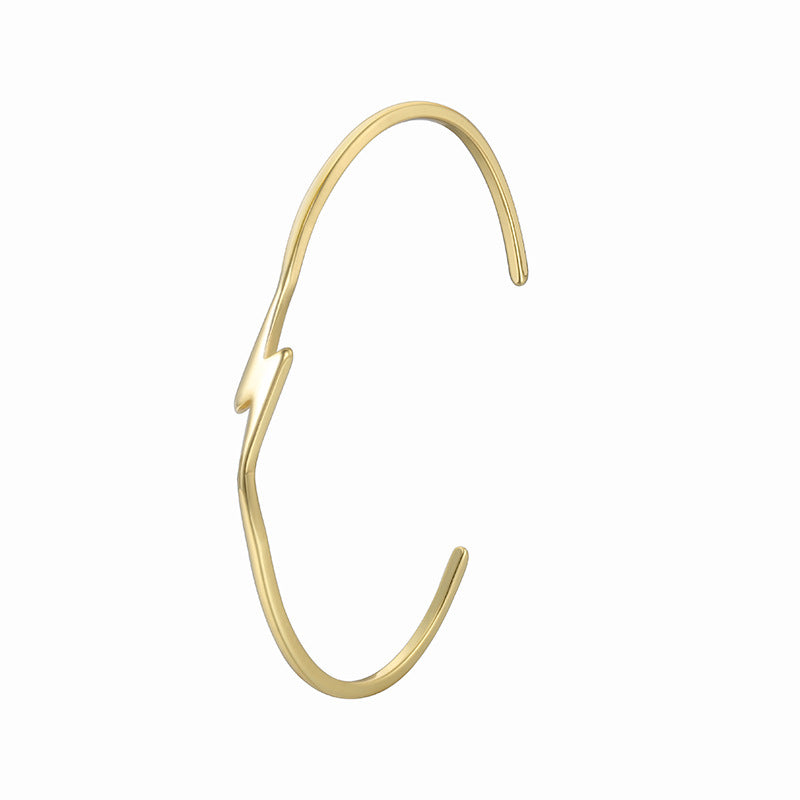 isolated side view of slender lightning bolt open bangle