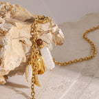 Gold-Tone Stainless Steel Ocean Charm Necklace — detail view
