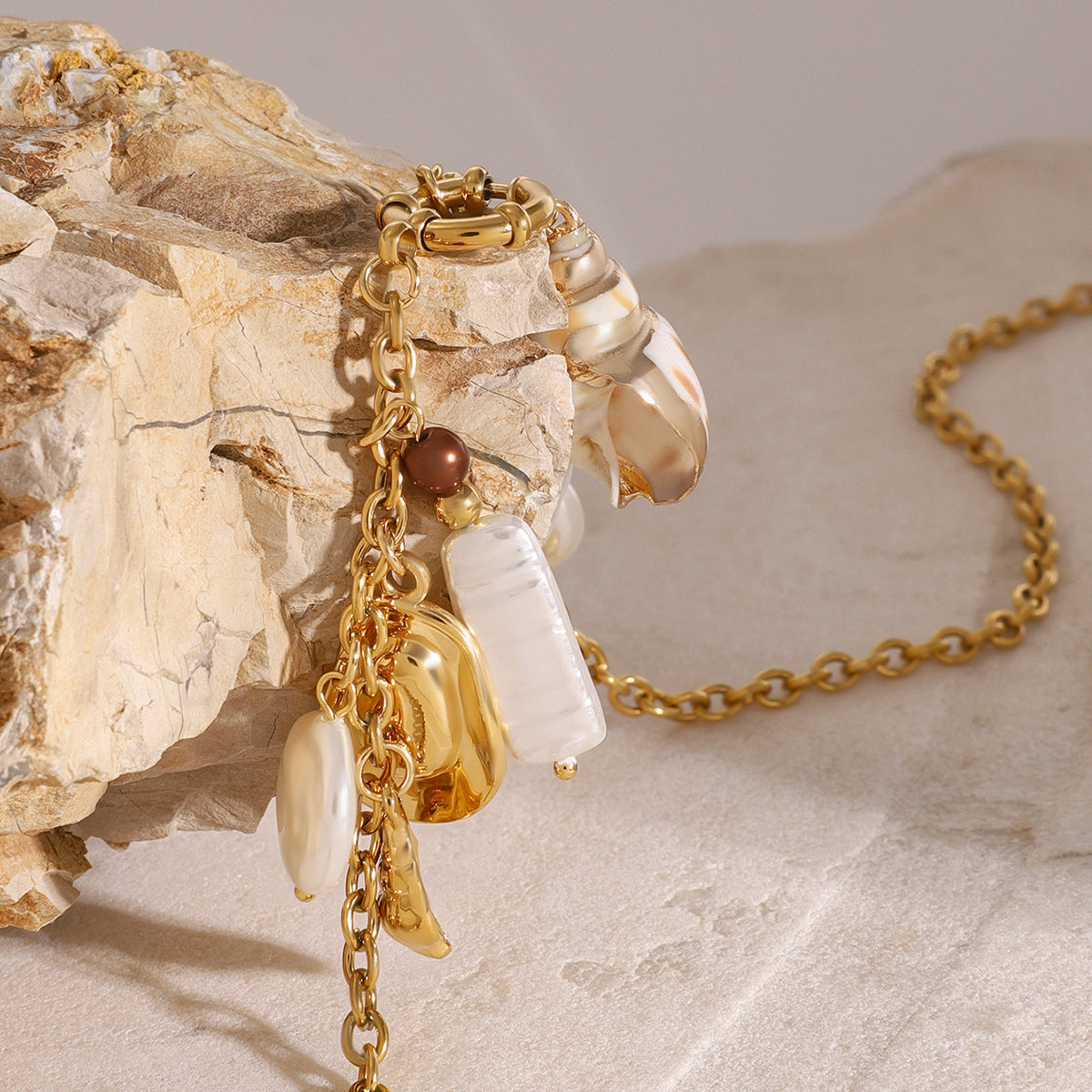Gold-Tone Stainless Steel Ocean Charm Necklace — detail view