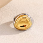 front view of domed gold plated and silver-finish signet ring