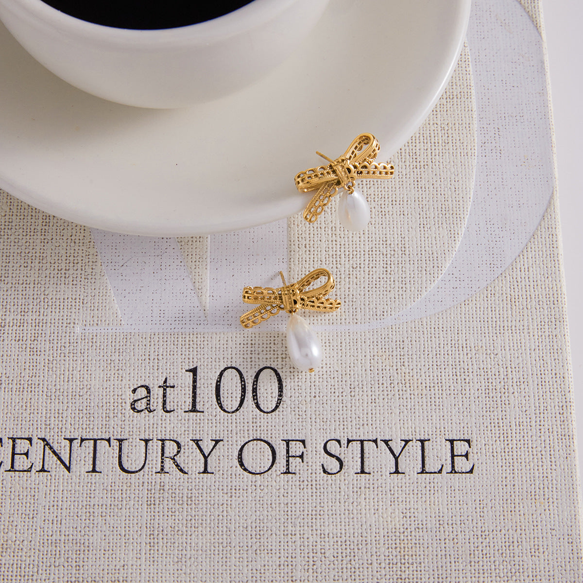 Gold-Tone Imitation Pearl Bow Drop Earrings — detail view