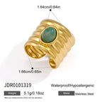 Ribbed open ring with a green oval accent