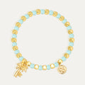 aqua and gold-color beaded bracelet with palm tree charm