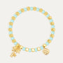 aqua and gold-color beaded bracelet with palm tree charm