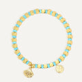 gold plated scallop shell charm bracelet with turquoise-color cube beads