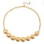Gold-Tone Pearl-Look Stainless Steel Necklace and Bracelet Collection finish and shape detail
