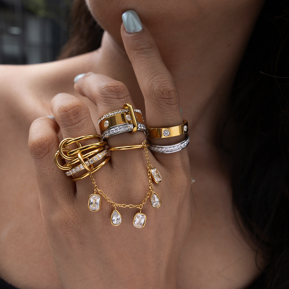 Close-up of linked stainless steel rings on the hand
