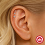 three graduated moissanite star flat-back studs worn along cartilage